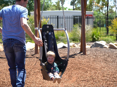 Toby and Scott on flying fox at Dubbo Regional Adventure Playground