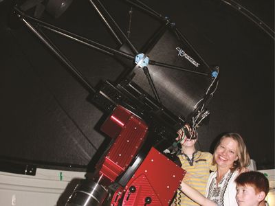 Dubbo Observatory Family exploring the universe through telescope