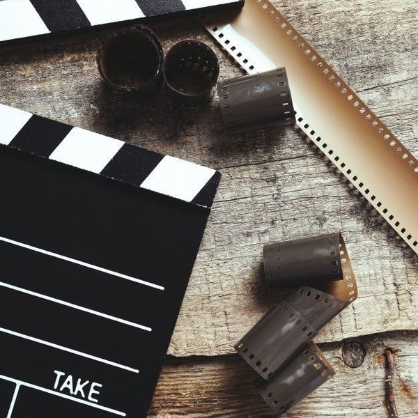 Premium Photo Retro film reel on burn background